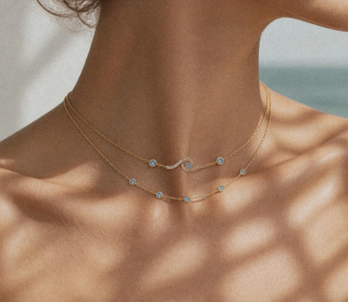 The Onda Necklace layered over the Mare Station Necklace