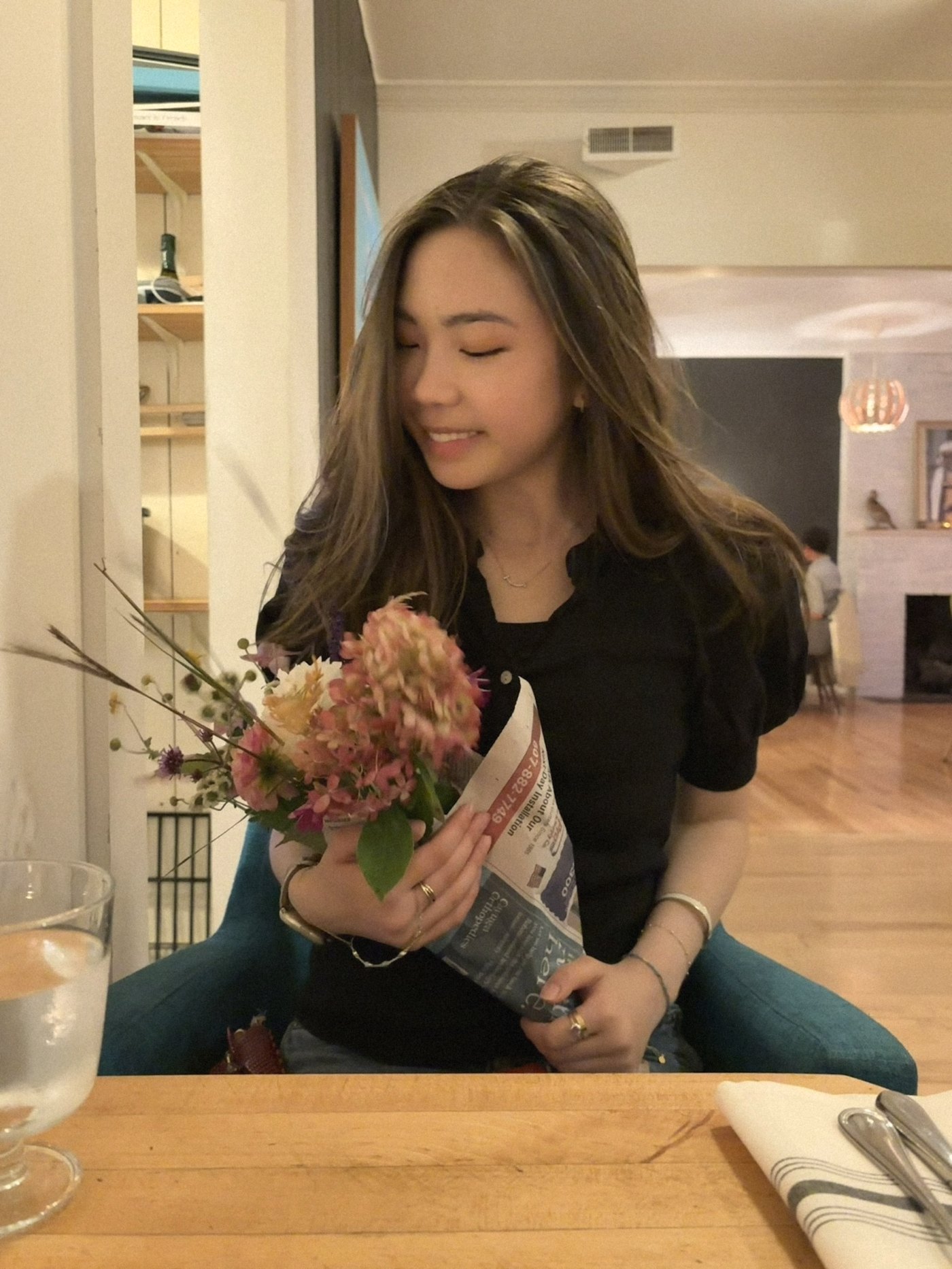 Chiara holding a bouquet of flowers
